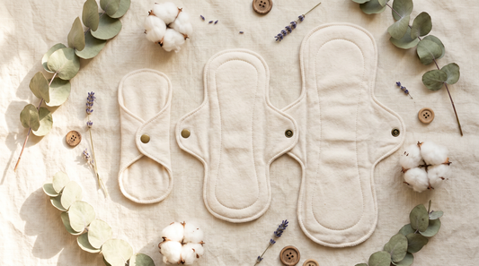 Three sizes of organic cotton pads arranged from small to large